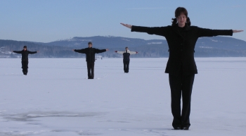Qigong training outdoors in a winter landscape